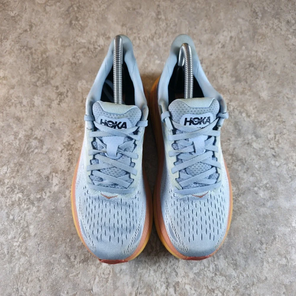 Hoka One One Women's Light Blue Running Shoes with Yellow and Orange Midsole